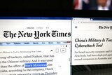A New York Times article is displayed on a laptop screen with Mark McGowan's name highlighted in it.