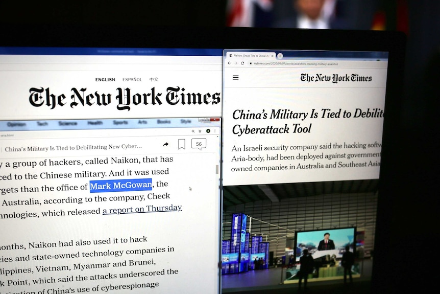 A New York Times article is displayed on a laptop screen with Mark McGowan's name highlighted in it.