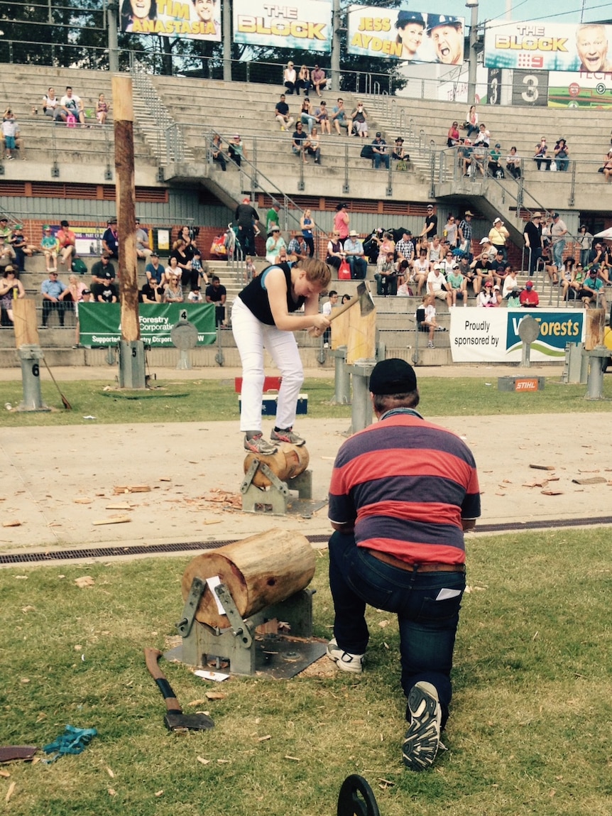 Kate Backhouse competes at a woodchopping event at the Royal Easter Show