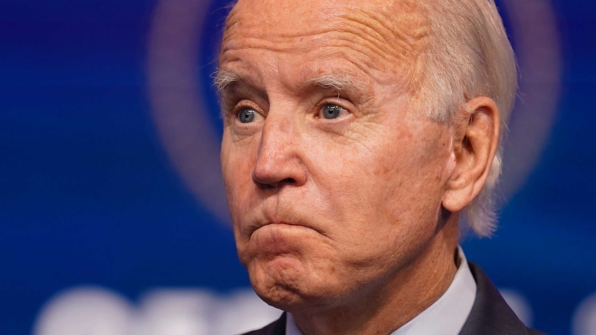 President-elect Joe Biden listens to a question as he speaks