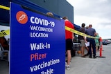 Pfizer COVID-19 vaccination sign at pop-up clinic outside a Bunnings hardware store in Queensland. 
