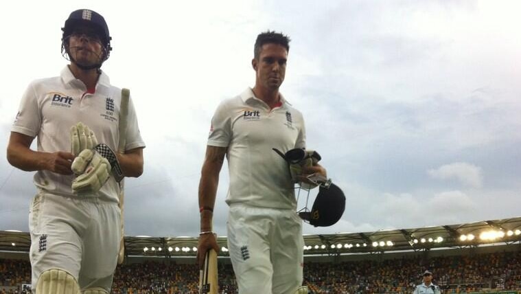 England's Alistair Cook and Kevin Pietersen walk off after day three of the Gabba Test in 2013.