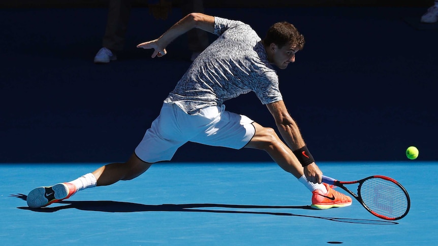 Grigor Dimitrov stretches out for a backhand return against David Goffin