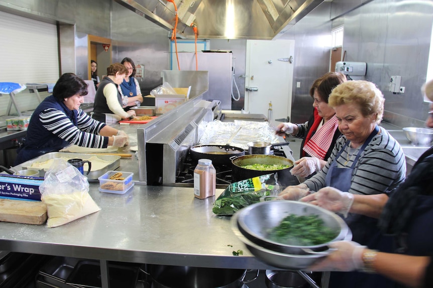 Greek women cook in Voula Delios's memory