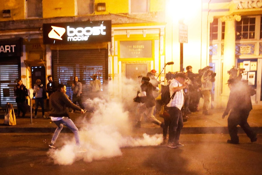 Police fire crowd control agents to disperse protesters in Baltimore