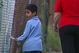 Sharthi visits his father with refugee advocate Alison Sloan at the Villawood Detention Centre.
