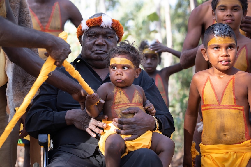 Yunupingu with Gumatj children at Garma in 2019.
