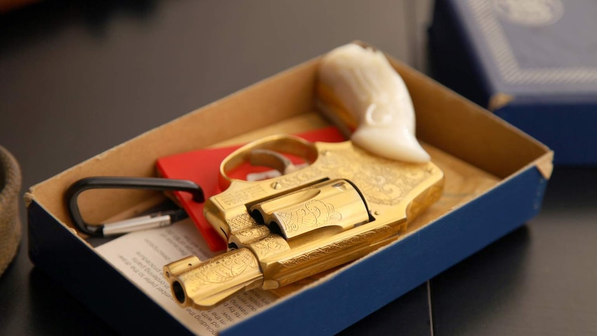 Phryne Fisher's gold pistol set in a box