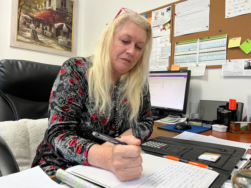 Engela Collins working at her desk. 