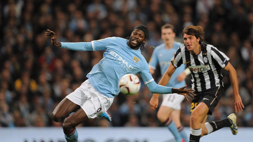 Manchester City's Emmanuel Adebayor vies for the ball with Paulo De Ceglie of Juventus at the City of Manchester Stadium