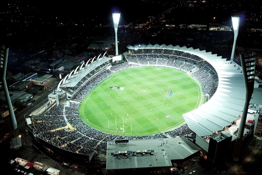 AFL stadium at night, aerial shot