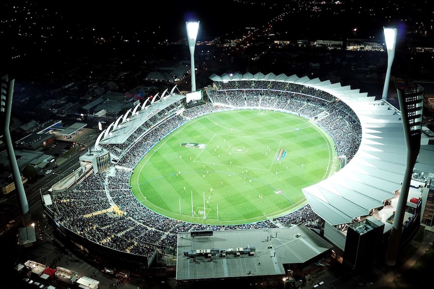 AFL stadium at night, aerial shot