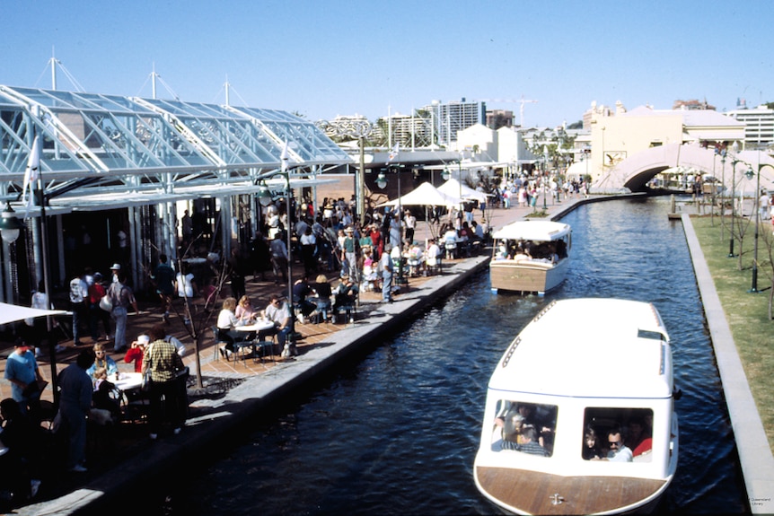 Boats travelling along the canal during opening celebrations at South Bank.