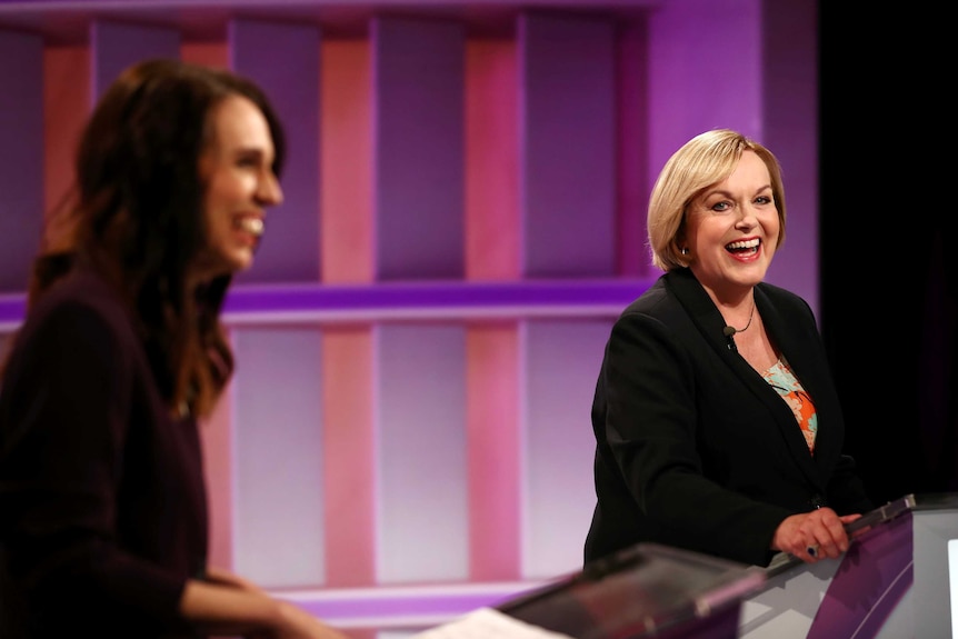 Judith Collins and Jacinda Ardern laughing at the debate