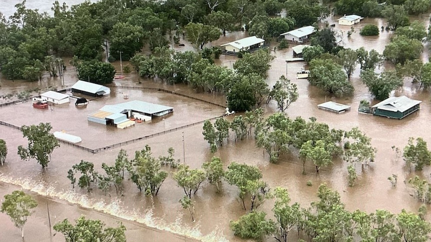 Floodwater engulfs the town of Fitzroy Crossing.