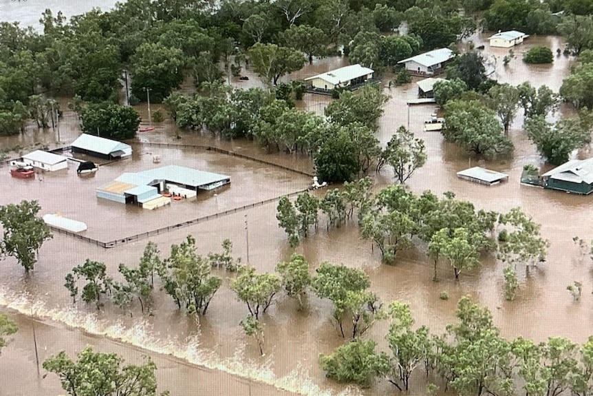Floodwater engulfs the town of Fitzroy Crossing.