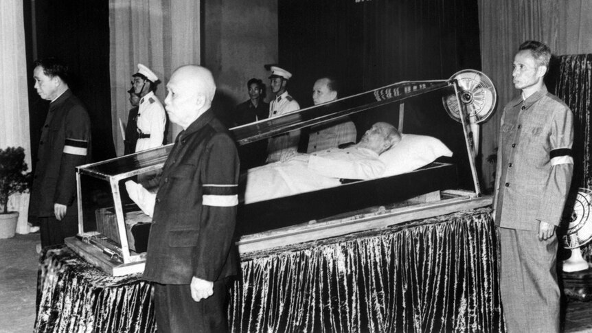 Members of the communist party surround the body of North Vietnamese president Ho Chi Minh.