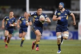 Christian Lealiifano runs in to score a try for the Brumbies against the Reds.