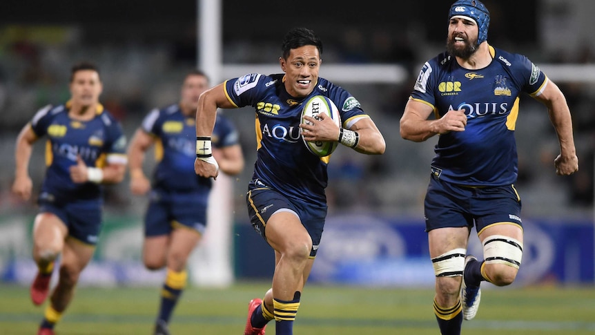 Christian Leali'ifano runs in to score a try for the Brumbies against the Reds