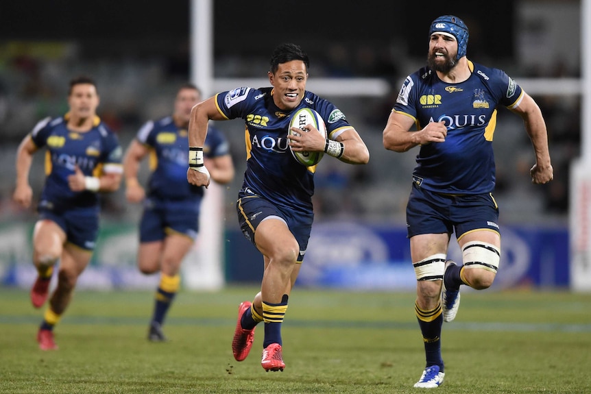 Christian Leali'ifano runs in to score a try for the Brumbies against the Reds