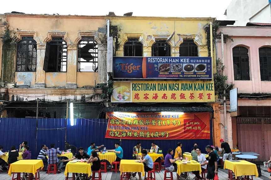 Colourful Chinese Malaysian restaurant stalls on the street in Kuala Lumpur's Chinatown, Malaysia.