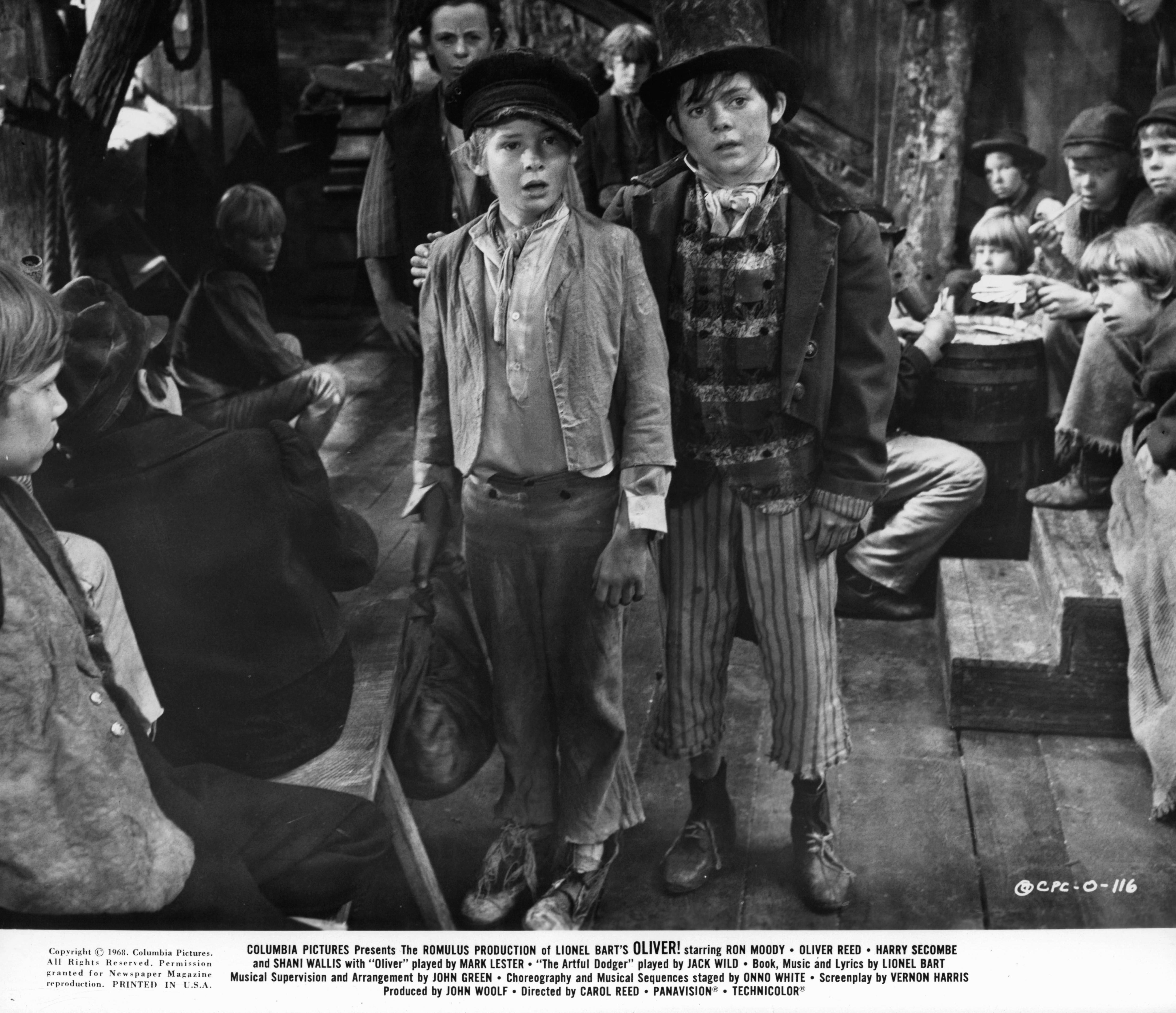 A black and white photo of the two main characters from the movie Oliver