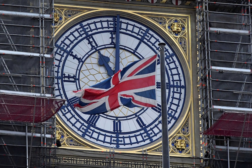 A close up shot of a union jack flag in front of Big Ben