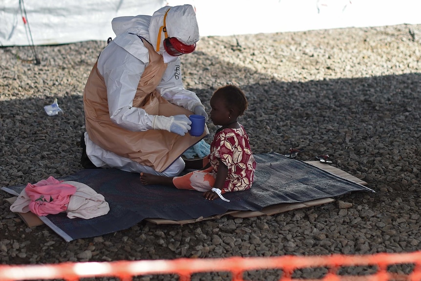Nurse with Ebola toddler in Sierra Leone