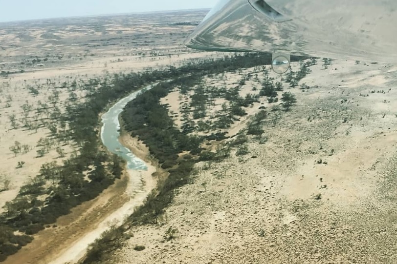 Looking down on an outback landscape from a plane.