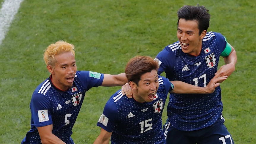 Japan's Yuya Osako roars with delight after scoring the winning goal