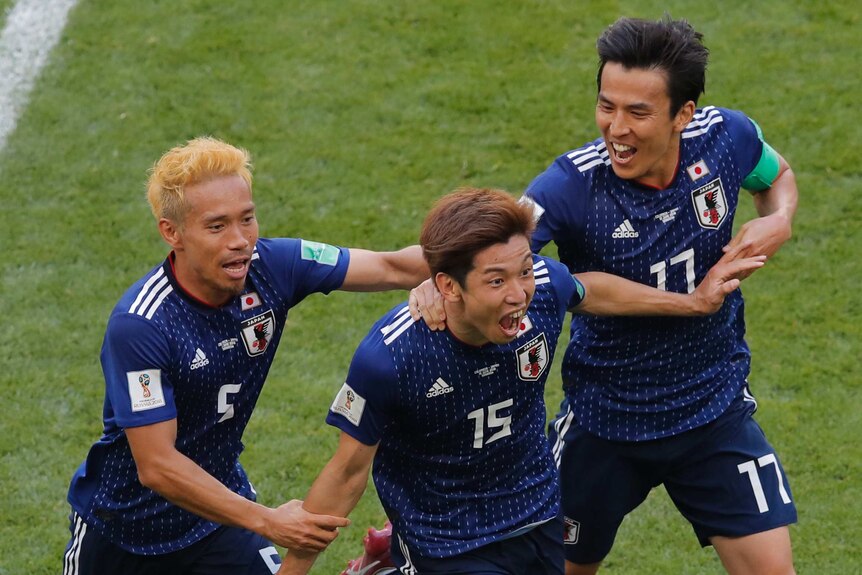 Japan's Yuya Osako roars with delight after scoring the winning goal