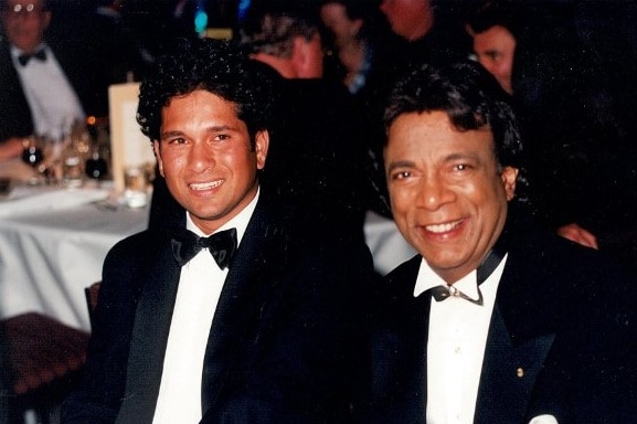 Two men in suits and bow ties.