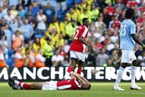 'Mindless': Adebayor apologised for his goal celebrations but not injuring van Persie.