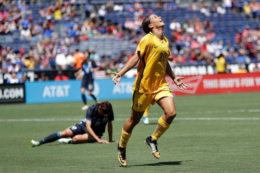 Sam Kerr celebrates against Japan