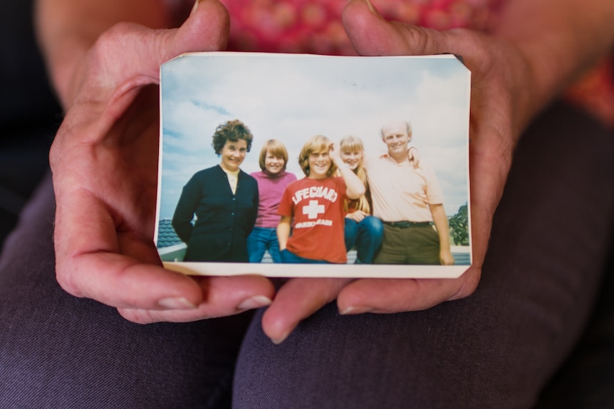 Rachel and her family with her brother Don front and centre in the photograph wearing a red t-sirt.