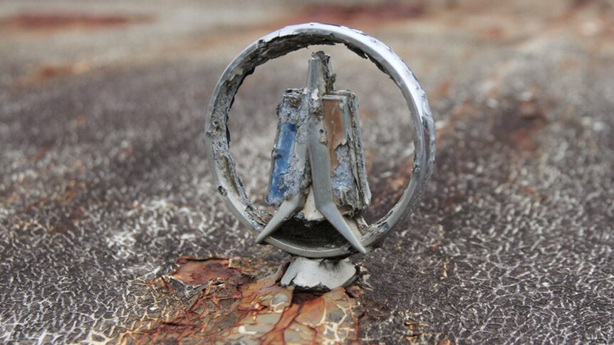 A rusted hood ornament