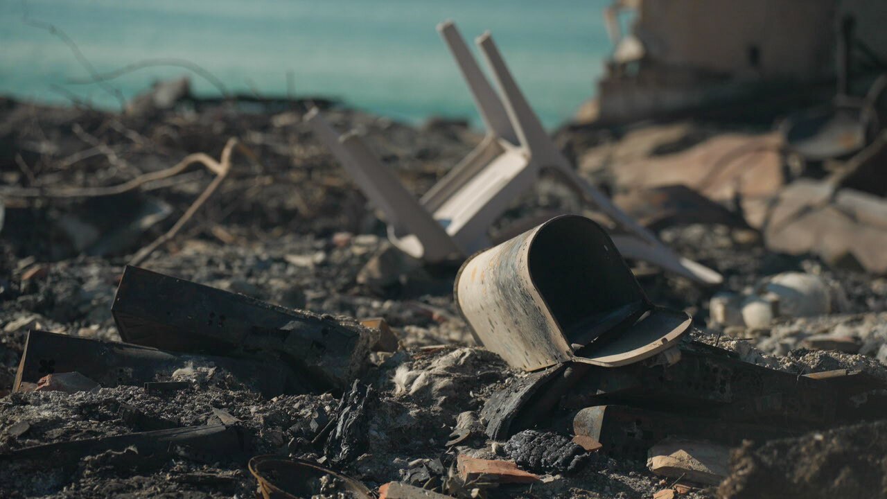 A mailbox and a plastic chair are the only recognisable remains after an LA home burned to the ground