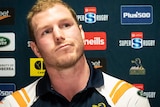 David Pocock looks to his left as he listens to questions at his Brumbies retirement media conference.