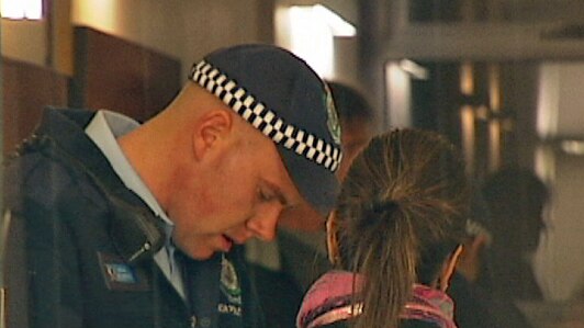Police interview residents in an Ultimo unit block where a woman found dead.