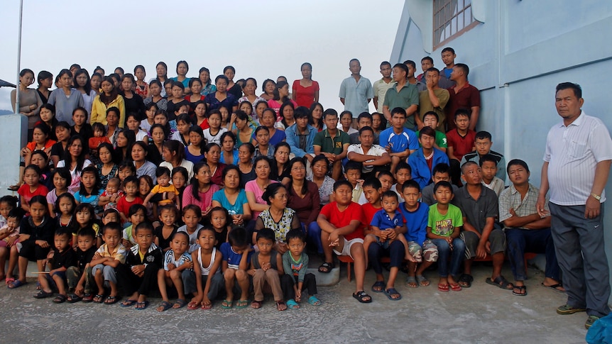 Family members of Ziona Chana pose for a group photograph.