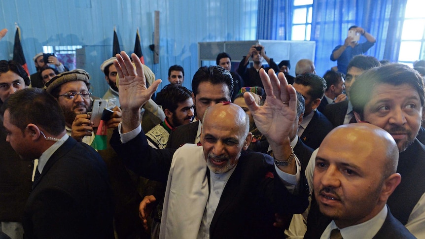 Afghan election winner Ashraf Ghani surrounded by a crowd in 2014.