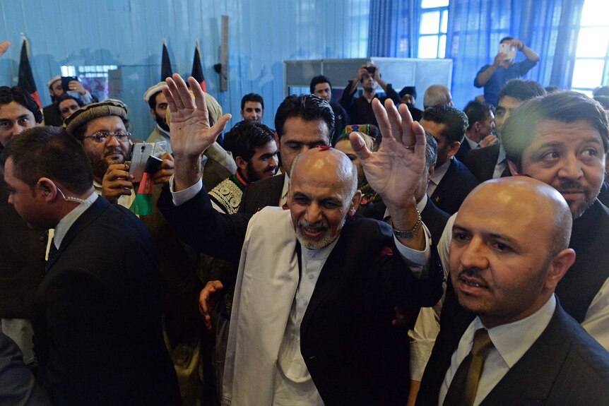 Afghan election winner Ashraf Ghani surrounded by a crowd in 2014.