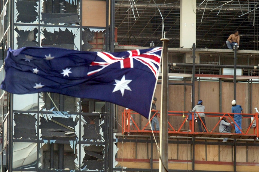 An Australian flag flies at the Australian embassy in Jakarta after a bomb attack