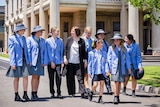 A teacher walks with teenage students in school uniform at Lowther Hall Anglican Girls Grammar School at Essendon in Victoria.