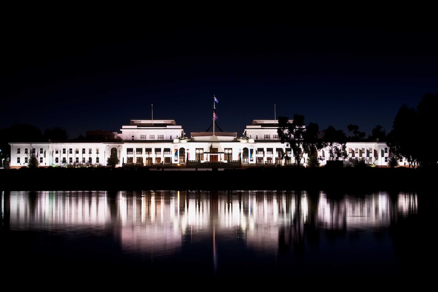 Old Parliament House and its reflection in water.