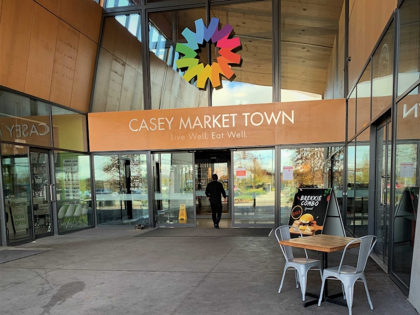 The front entrance for a shopping centre with a sign 'Casey Markey Town'.