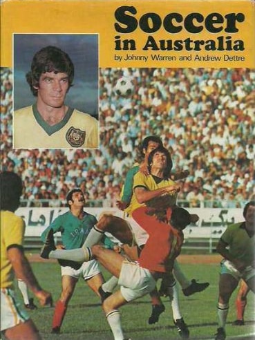 A book called Soccer in Australia with an inset of Johnny Warren.