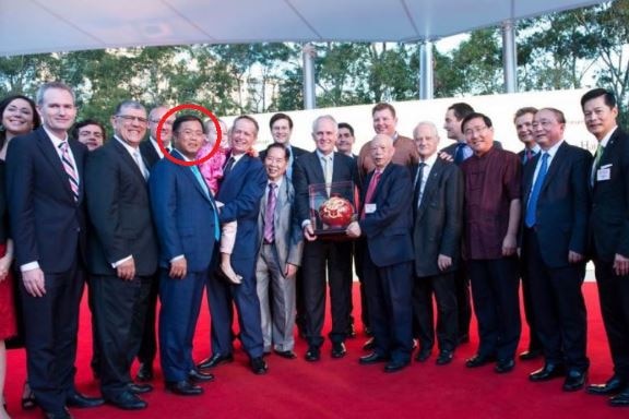 Mr Huang at the launch of the chinese new year lantern festival in suit and tie with government officials