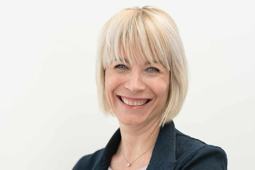 Head shot of Dr Cristy Seccombe from AVA, smiling and folding her arms