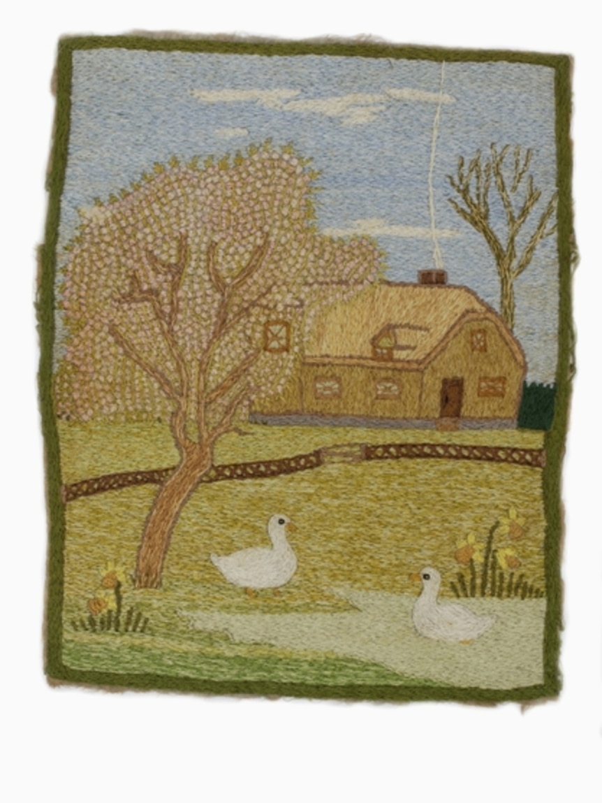 Embroidery depicting French farmhouse